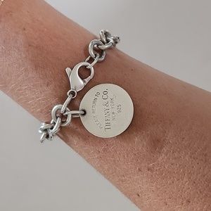Return to Tiffany and Co Silver circle tag bracelet.